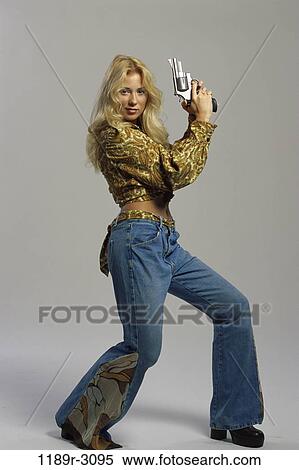 people, woman, gun, holding, blond, posing, hold View Large Photo Image Stock Photography - people, woman, gun, holding, blond, posing, hold. Fotosearch