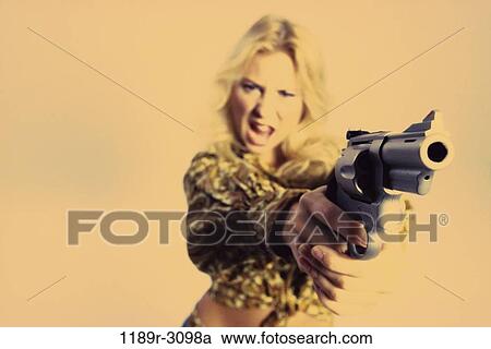 people, woman, gun, pointing, confrontation, violence, risk View Large Photo Image Stock Image - people, woman, gun, pointing, confrontation, violence, risk. Fotosearch