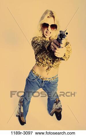 people, woman, gun, sunglasses, pointing, confrontation, violence View Large Photo Image Stock Photo - people, woman, gun, sunglasses, pointing, confrontation, violence. Fotosearch