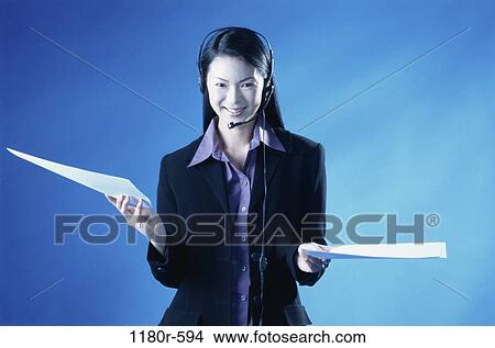 people, woman, headset, Asian, papers, holding, business View Large Photo Image Picture - people, woman, headset, Asian, papers, holding, business. Fotosearch
