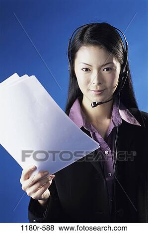 people, woman, headset, Asian, papers, holding, business View Large Photo Image Stock Photo - people, woman, headset, Asian, papers, holding, business. Fotosearch
