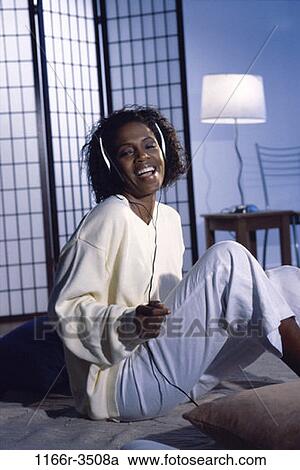 people, woman, headset, listening, sitting, music, laughing View Large Photo Image Stock Image - people, woman, headset, listening, sitting, music, laughing. Fotosearch