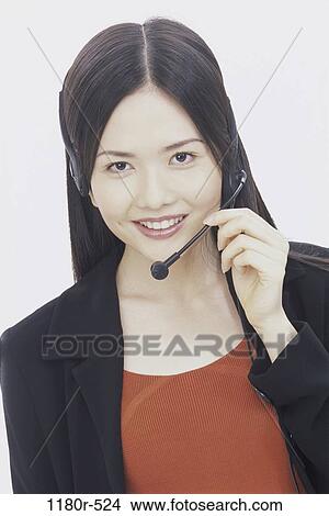 people, woman, headset, talking, Asian, business, customer service View Large Photo Image Picture - people, woman, headset, talking, Asian, business, customer service. Fotosearch