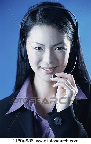 people, woman, headset, talking, Asian, business, customer service View Large Photo Image Stock Photograph - people, woman, headset, talking, Asian, business, customer service. Fotosearch
