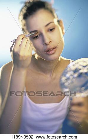 people, woman, Hispanic, mirror, makeup, beauty, brunette View Large Photo Image Stock Image - people, woman, Hispanic, mirror, makeup, beauty, brunette. Fotosearch