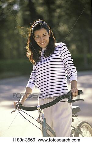 people, woman, Hispanic, outdoors, cycling, brunette, recreation View Large Photo Image Stock Photo - people, woman, Hispanic, outdoors, cycling, brunette, recreation. Fotosearch