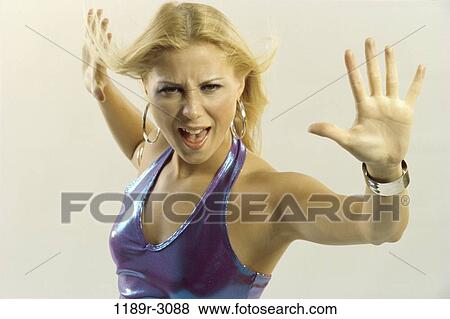 Stock Photo - people, woman, jewelry, blond, indoors, Caucasian, young adult. Fotosearch