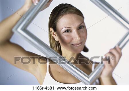 people, woman, Middle-aged, frame, brunette, picture, indoors View Large Photo Image Stock Image - people, woman, Middle-aged, frame, brunette, picture, indoors. Fotosearch