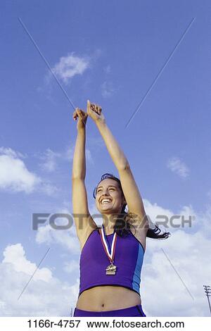 people, woman, outdoors, achievement, brunette, winning, win View Large Photo Image Stock Photo - people, woman, outdoors, achievement, brunette, winning, win. Fotosearch