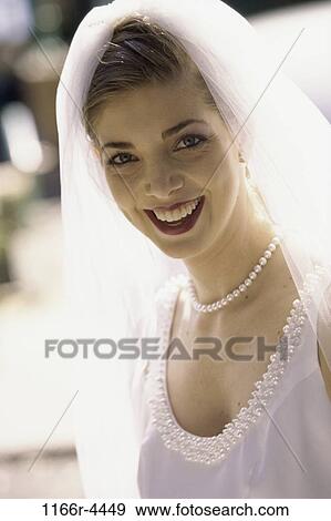 Stock Photo - people, woman, outdoors, wedding, brunette, bride, headshot. Fotosearch