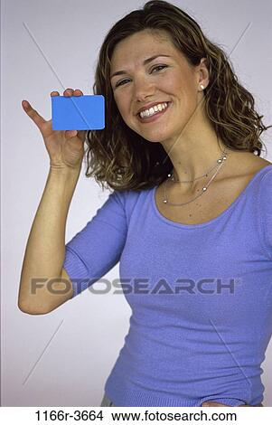 people, woman, personal finance, brunette, credit card, indoors, Caucasian View Large Photo Image Picture - people, woman, personal finance, brunette, credit card, indoors, Caucasian. Fotosearch