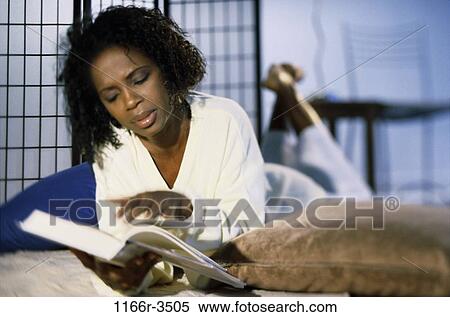 people, woman, reading, book, brunette, indoors, African-American View Large Photo Image Stock Photography - people, woman, reading, book, brunette, indoors, African-American. Fotosearch