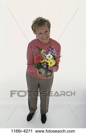 people, woman, senior, flowers, bouquet, indoors, Caucasian View Large Photo Image Stock Image - people, woman, senior, flowers, bouquet, indoors, Caucasian. Fotosearch