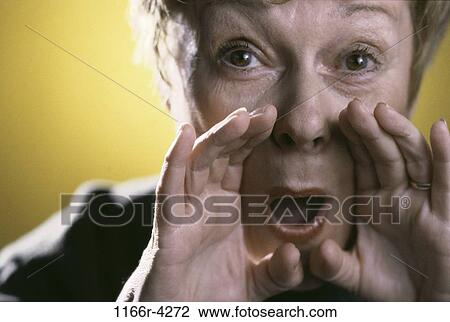Stock Image - people, woman, senior, yelling, indoors, close-up, Caucasian. Fotosearch
