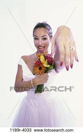 people, woman, showing, wedding, bouquet, bride View Large Photo Image Stock Image - people, woman, showing, wedding, bouquet, bride. Fotosearch