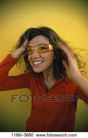 Stock Image - people, woman, sunglasses, brunette, indoors, Caucasian, young adult. Fotosearch