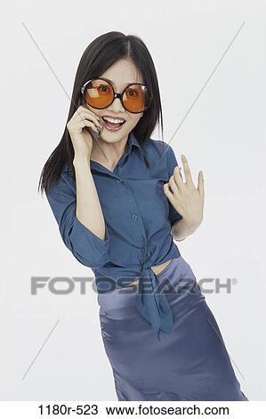 people, woman, telephone, talking, Asian, phone, sunglasses View Large Photo Image Stock Image - people, woman, telephone, talking, Asian, phone, sunglasses. Fotosearch