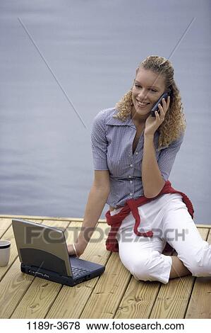people, woman, telephone, talking, computer, laptop, phone View Large Photo Image Stock Photo - people, woman, telephone, talking, computer, laptop, phone. Fotosearch