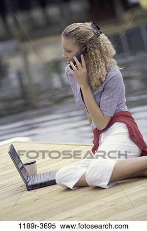 people, woman, telephone, talking, computer, laptop, phone View Large Photo Image Stock Photography - people, woman, telephone, talking, computer, laptop, phone. Fotosearch