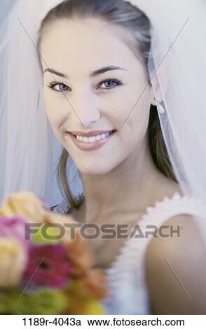 Stock Image - people, woman, wedding, bouquet, veil, bride. Fotosearch