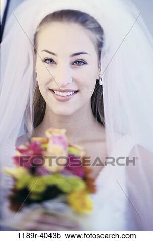 Stock Image - people, woman, wedding, bouquet, veil, bride. Fotosearch