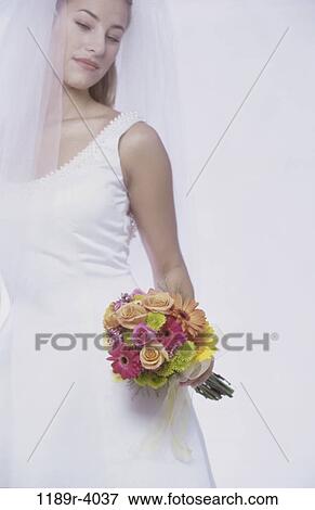 Stock Photo - people, woman, wedding, bouquet, veil, bride. Fotosearch