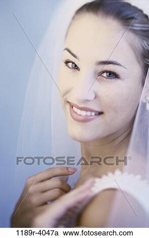 Stock Image - people, woman, wedding, veil, bride, marriage. Fotosearch