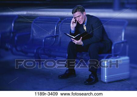 Stock Photo - planner, talking, phone, business, Middle-aged, waiting. Fotosearch