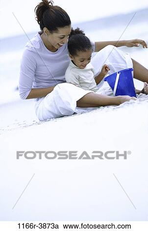 sand, people, playing, mother, beach, family, play View Large Photo Image Stock Image - sand, people, playing, mother, beach, family, play. Fotosearch