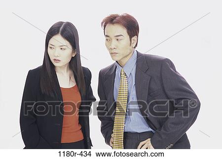 serious, coworkers, confrontation, business, Asian, anger View Large Photo Image Picture - serious, coworkers, confrontation, business, Asian, anger. Fotosearch