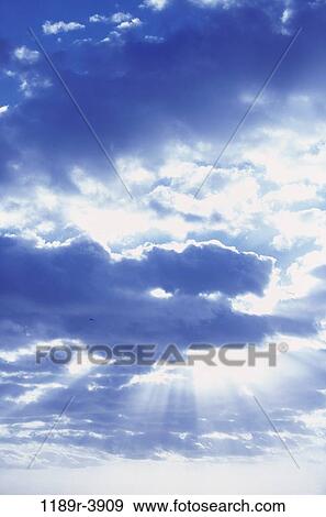 Stock Photo - sky, floating, clouds, sunlight, cloudy, nature, inspirational. Fotosearch