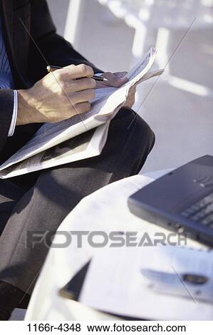 table, newspaper, reading, laptop, cafe, business View Large Photo Image Stock Photo - table, newspaper, reading, laptop, cafe, business. Fotosearch