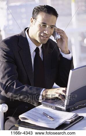 telephone, talking, eyeglasses, Hispanic, computer, laptop View Large Photo Image Stock Image - telephone, talking, eyeglasses, Hispanic, computer, laptop. Fotosearch