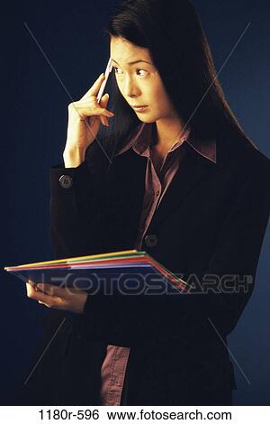 Stock Photograph - woman, Asian, business, administrative, contemplating, indoors, contemplate. Fotosearch