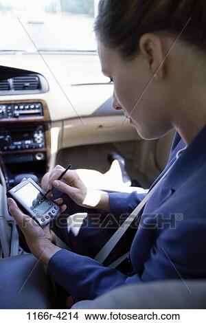 Picture - woman, computer, car, business, using, travel, businesswoman. Fotosearch