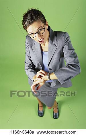 woman, eyeglasses, watch, stress, business, indoors, anticipating View Large Photo Image Stock Image - woman, eyeglasses, watch, stress, business, indoors, anticipating. Fotosearch
