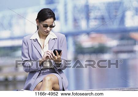 woman, Hispanic, computer, sunglasses, outdoors, checking View Large Photo Image Stock Image - woman, Hispanic, computer, sunglasses, outdoors, checking. Fotosearch