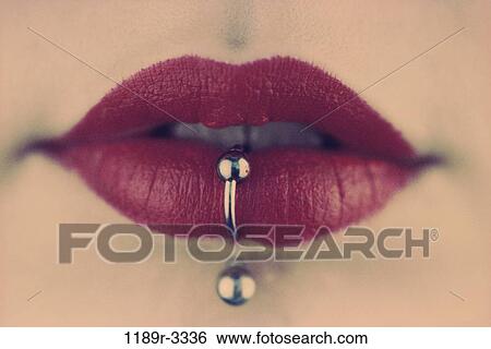 Stock Photograph - woman, mouth, body parts, lips, serious, lipstick, piercing. Fotosearch