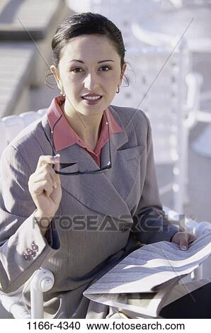 woman, newspaper, eyeglasses, sitting, reading, business, outdoors View Large Photo Image Stock Image - woman, newspaper, eyeglasses, sitting, reading, business, outdoors. Fotosearch