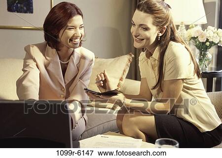 Stock Photo - women, home, computer, laptop, business, home office. Fotosearch