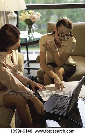 Stock Photo - women, home, eyeglasses, computer, laptop, business, home office. Fotosearch