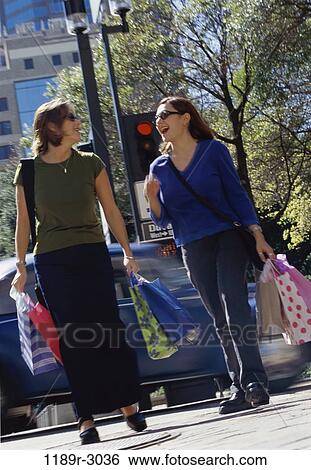 women, people, sunglasses, outdoors, carrying, shopping, friends View Large Photo Image Stock Photograph - women, people, sunglasses, outdoors, carrying, shopping, friends. Fotosearch
