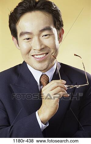young adult, eyeglasses, indoors, businessman, business, Asian View Large Photo Image Stock Photo - young adult, eyeglasses, indoors, businessman, business, Asian. Fotosearch