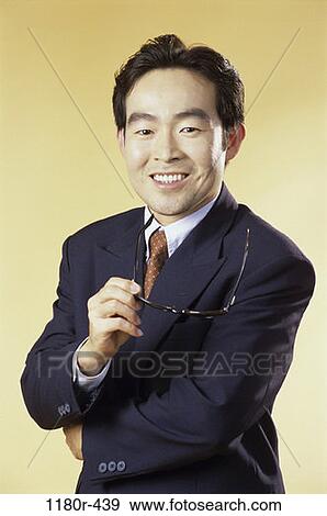 young adult, eyeglasses, indoors, businessman, business, Asian View Large Photo Image Stock Photo - young adult, eyeglasses, indoors, businessman, business, Asian. Fotosearch