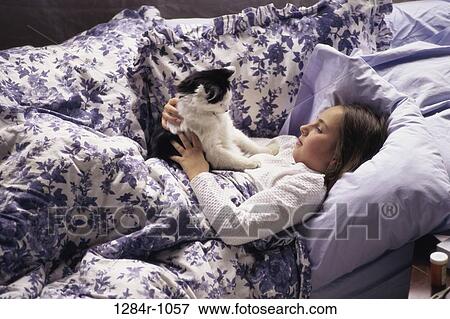 bed, cat, pet, girl, child, laying View Large Photo Image Stock Photo - bed, cat, pet, girl, child, laying. Fotosearch