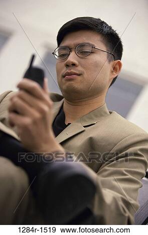 dial, dialing, telephone, Asian, eyeglasses, phone, business View Large Photo Image Stock Photo - dial, dialing, telephone, Asian, eyeglasses, phone, business. Fotosearch