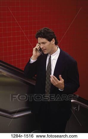 Stock Photograph - escalator, telephone, talking, phone, business, outdoors. Fotosearch