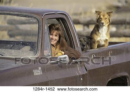Stock Image - farm, fence, farming, people, woman, smiling, animals. Fotosearch