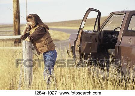 fence, people, woman, telephone, road, talking View Large Photo Image Stock Photo - fence, people, woman, telephone, road, talking. Fotosearch