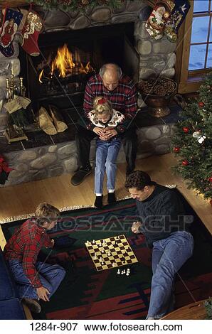 fire, chess, stone, Christmas, fireplace, hugging View Large Photo Image Stock Photo - fire, chess, stone, Christmas, fireplace, hugging. Fotosearch